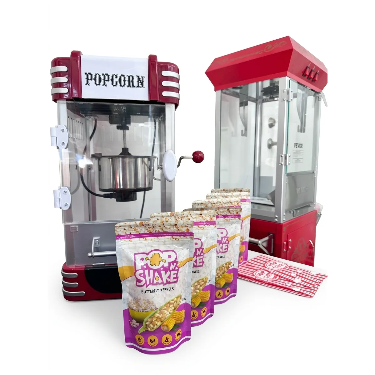 Large and small red popcorn machines displayed together with popcorn supplies