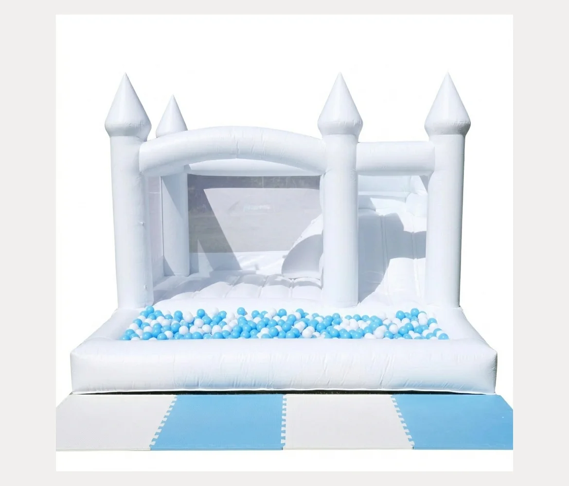 Large white jumping castle with blue and white ball pit balls